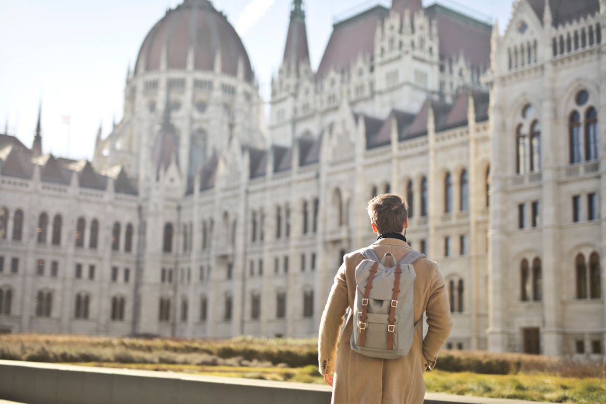 Tourist looking at the Hungarian Parliament in Budapest