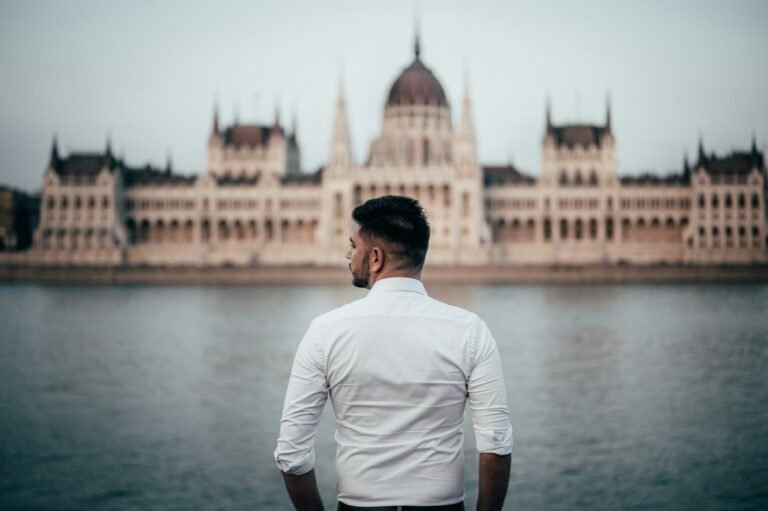 Image of a businessman looking at the Danube river in Budapest, Hungary.