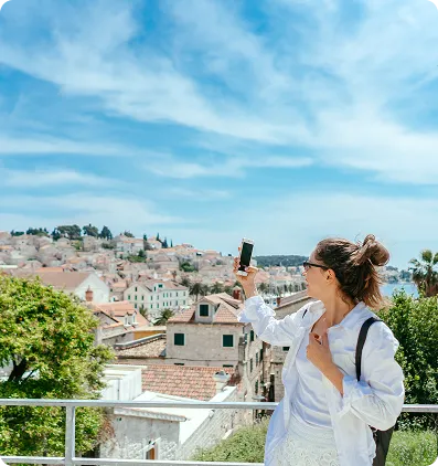 Traveller photographing a European city while exploring residency options