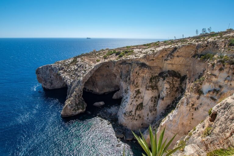 The Blue Grotto sea cliffs on Malta's south coast, an EU permanent residency destination for Nigerian investors and families