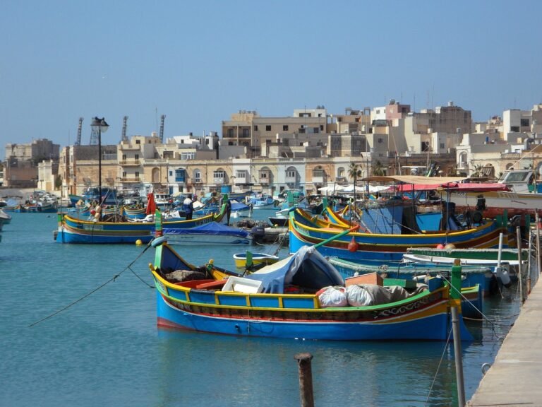 Traditional fishing boats in Marsaxlokk harbour, Malta, a residency destination for US citizens